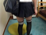 Asian teen in a school uniform enjoying a sensual sex play